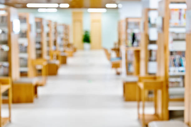 istock Defocused of bookshelves in modern public library 1141159184