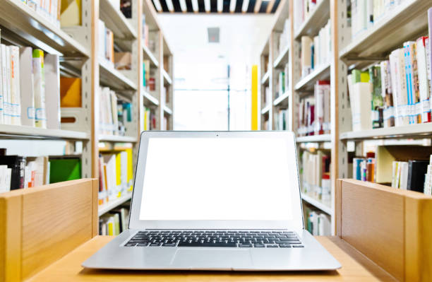 istock Blank laptop on the table of library 1141160207