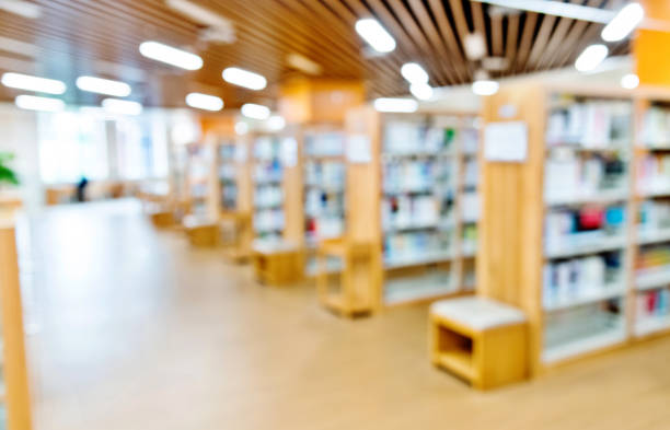 istock Defocused of bookshelves in modern public library 1141160608