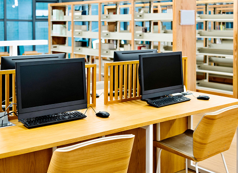 Computer Space And Library Computer And Bookshelves In Modern Library Stock Photo - Download Image ...