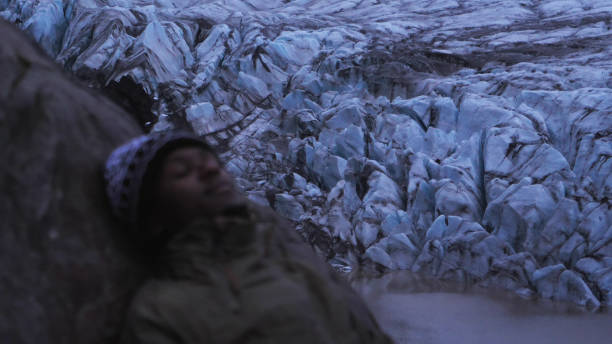 African ethnicity man admiring glacier