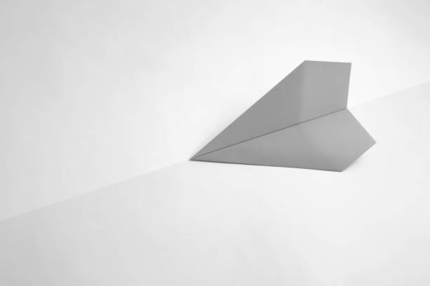 istock paper airplane on pastel background. Minimal flat lay school concept. 1141163728