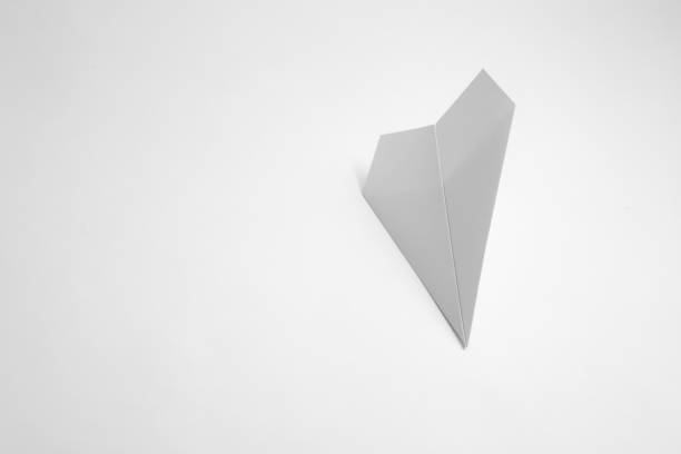 istock paper airplane on pastel background. Minimal flat lay school concept. 1141163826