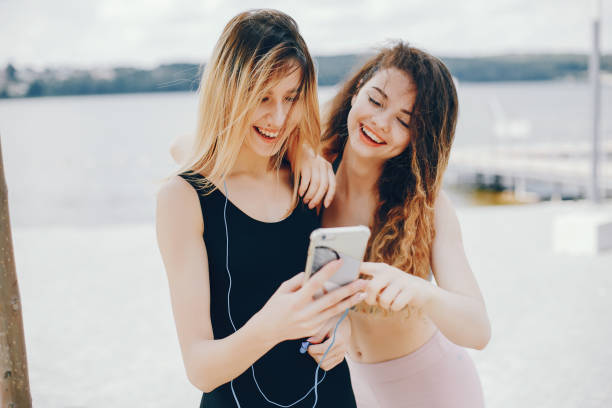 istock Two athletic girls have a rest 1141164467