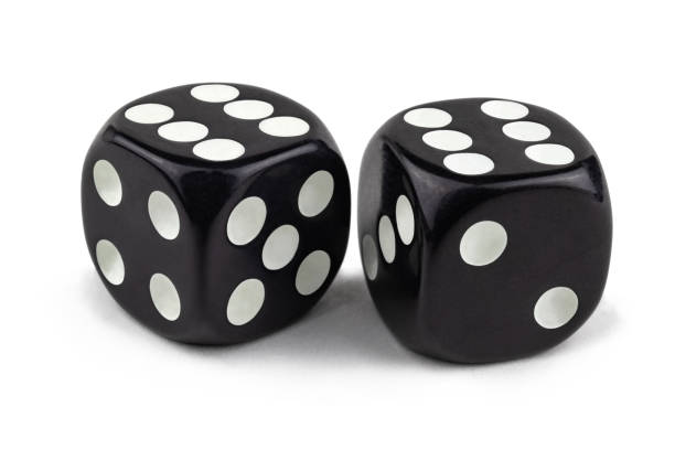 istock Two black dice isolated on a white background. Six and six are so close. 1141165494