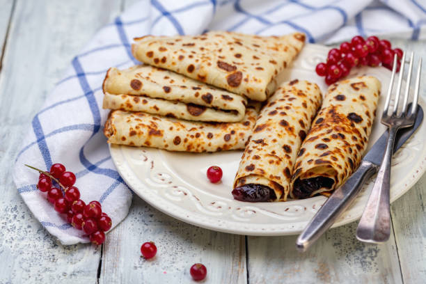istock Norwegian pancakes stuffed with berry jam. 1141165976