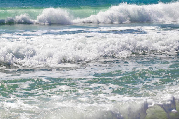 istock Beautiful turquoise azure waves with white foam 1141166143