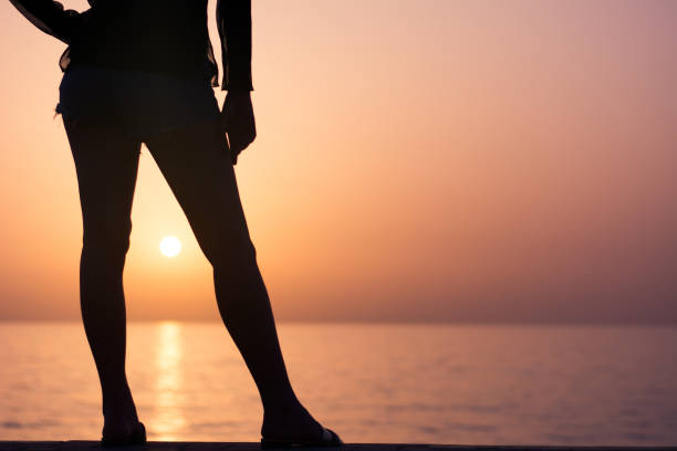 istock Woman with sunset between her legs 1141166984