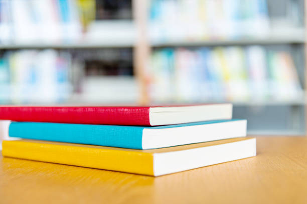 istock Stack of books on the desk of library 1141170424