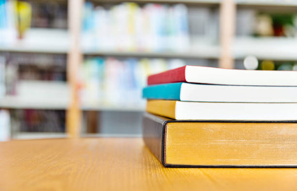 istock Stack of books on the desk of library 1141170449