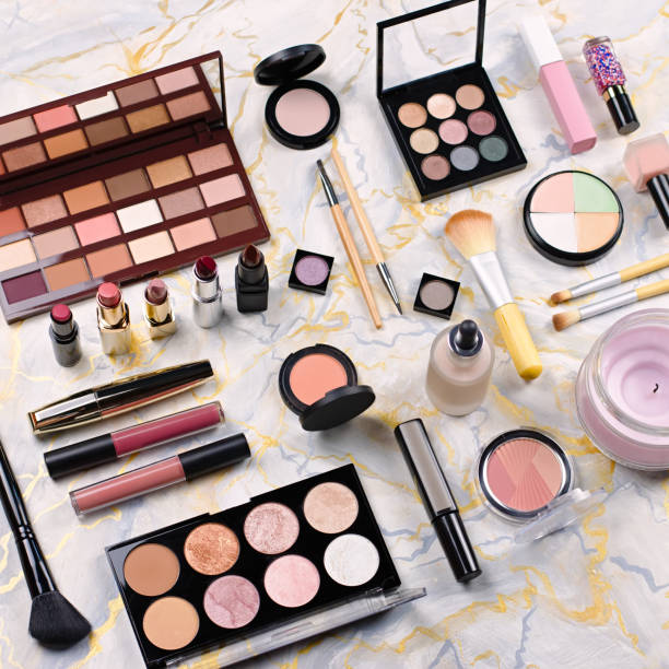istock Various makeup products on table, flat design. Woman cosmetic essentials, top view 1141171073