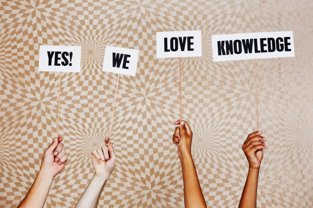istock Raised hands hold signs 