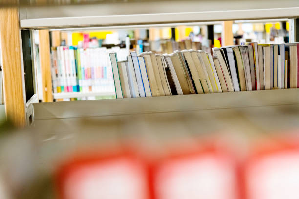 istock Close up of books in library bookshelf 1141171932