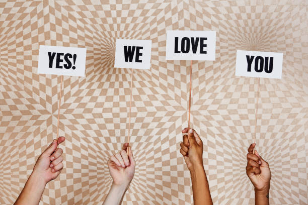 istock Raised hands hold signs 