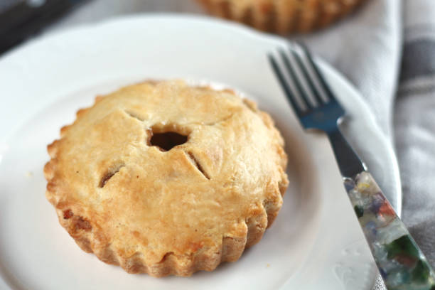 istock Traditional rustic homemade american  pie on white plate 1141175701