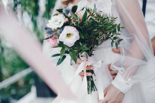 istock Beautiful bride in a long white wedding dress 1141177394