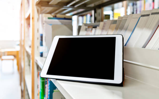 istock Blank digital tablet on the bookshelf 1141177606