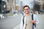 Portrait of a smiling casual man in urban background.