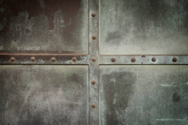 istock Dark metal background crossed lines and rivets 1141180559