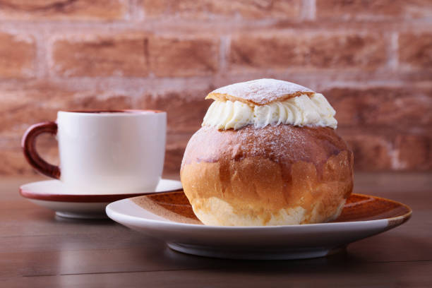 istock Traditional swedish dessert Semla, also called Shrove bun, with almond paste and whipped cream filling. 1141182109