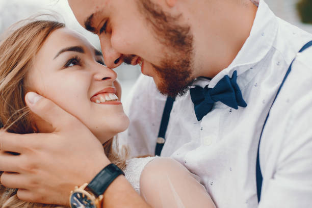 istock Beautiful bride with her husband in a park 1141182126