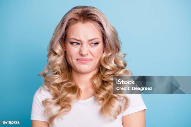 Close Up Photo Beautiful Her She Lady Awful Awkward Situation Look Hate Mad Rage Outraged Ugh Facial Expression Wear Casual White Tshirt Jeans Denim Clothes Outfit Isolated Bright Blue Background Stock Photo - Download Image Now