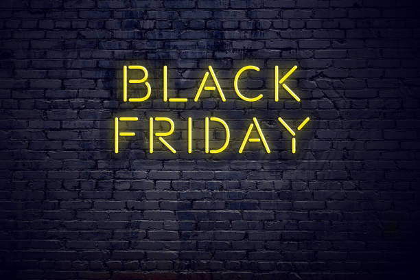 Night view of neon sign with text black friday stock photo