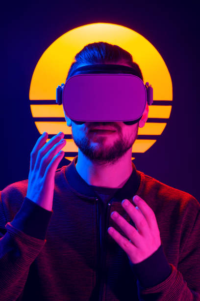 istock Man wearing virtual reality goggles synthwave futuristic aesthetics. 1141184062