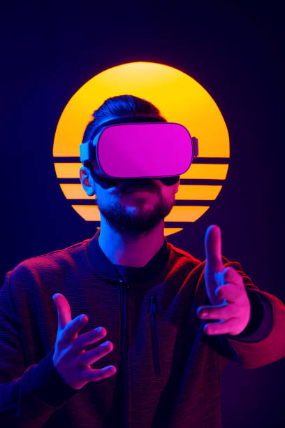 istock VR video game experience in 80's synth wave and retro wave futuristic aesthetics. 1141184259