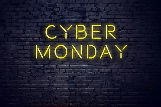 Photo of Night view of neon sign with text cyber monday