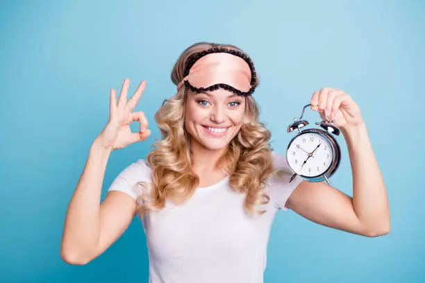 Close-up portrait of her she nice-looking sweet lovely winsome attractive cheerful cheery wavy-haired lady showing ok-sign isolated over blue pastel background.