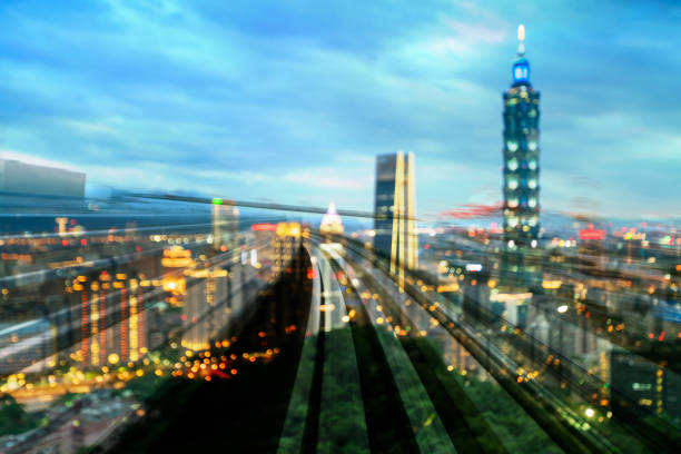 Train track over Taipie blur light cityscape downtown, abstract background