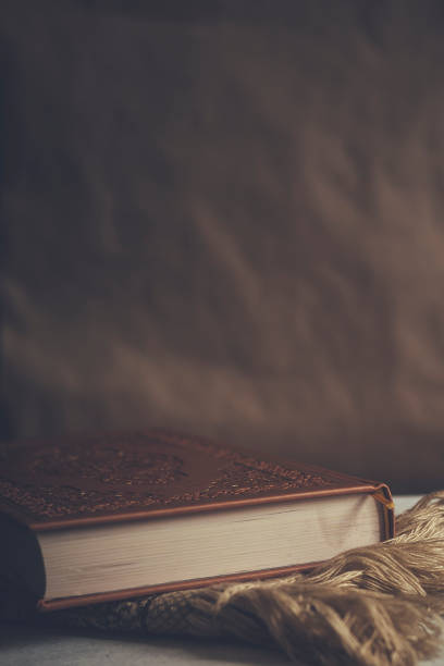 istock The Holy Quran on praying carpet. Flat lay view 1141190037