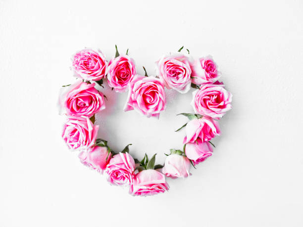 istock Vintage heart from pink roses on a white background. 1141190304