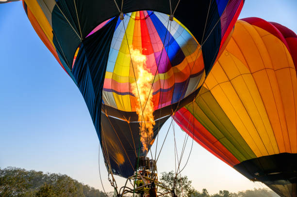 istock Colorful hot air balloons with burning an inflatable 1141191469