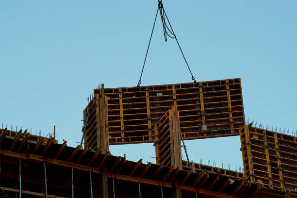 istock construction of the building cranes in the strongest light, otherwise 1141192739
