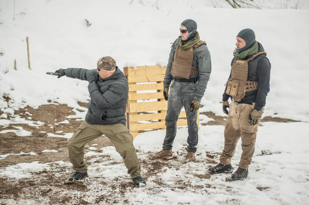 istock Instructor demonstrate action combat tactical gun shooting to his students 1141192901