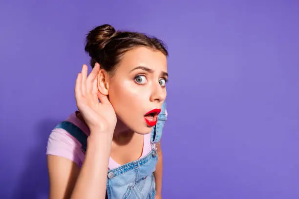 Close up photo beautiful funny funky she her lady two buns hear rumours like news red lipstick pomade hand arm wear casual t-shirt jeans denim overalls clothes isolated purple violet background