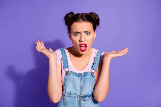Close up photo beautiful amazing she her lady two buns red lipstick pomade what's wrong with you facial expression wear casual t-shirt jeans denim overalls clothes isolated purple violet background