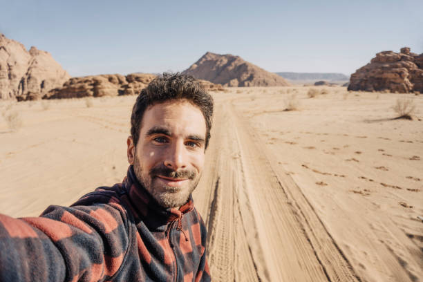 istock Young traveller taking a selfie in Wadi Rum desert 1141197345