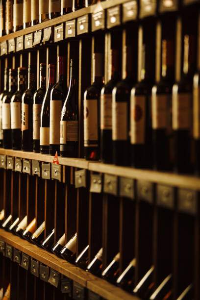 istock Wine cellar with elite drinks on shelves with written names 1141197877