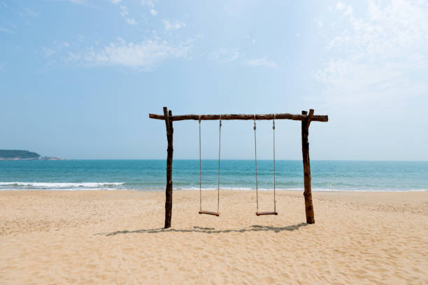 istock Swing on the beauty beach 1141198128