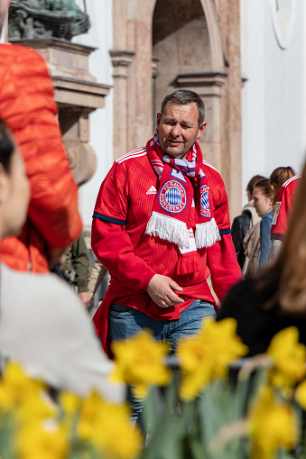 Stachus, Munich, April 6, 2019: fc bayern fan on the way to a public viewing location for the soccer game fc bayern munich vs bvb