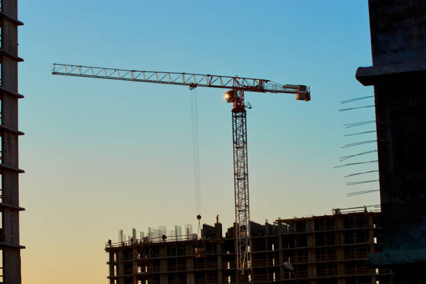 istock construction of the building cranes in the strongest light, otherwise 1141201666