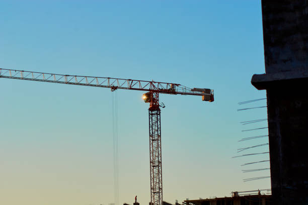 istock construction of the building cranes in the strongest light, otherwise 1141201839