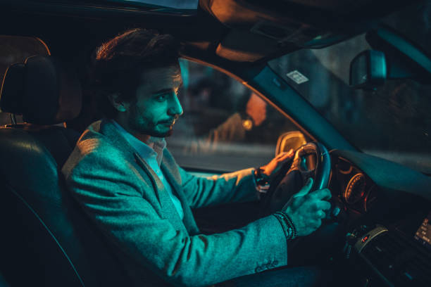 istock Modern gentleman driving a car 1141201942