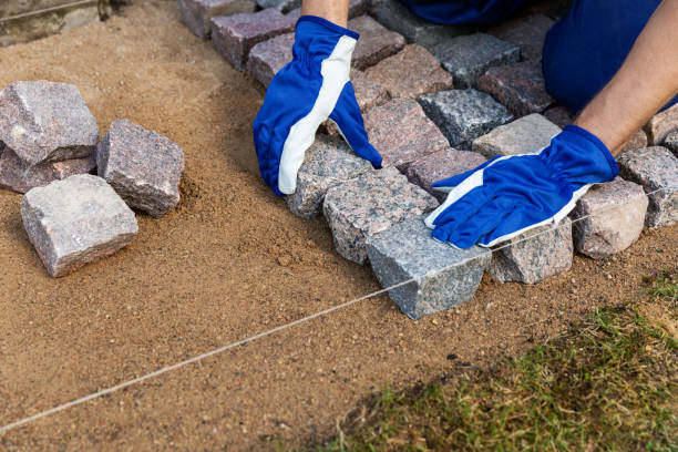 istock cobblestone installation - paver laying granite stone pavers 1141204237