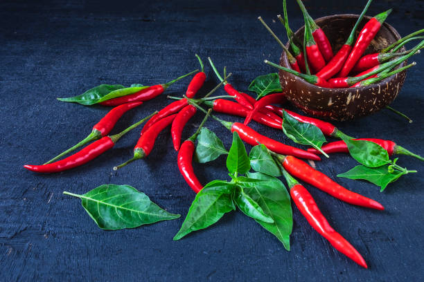 istock Red Hot Chili Pepper On black wood floor 1141204893