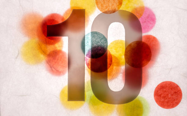 istock 10 number ten, graphic black digit and creative typography with many colourful wheels, happy birthday 1141205161