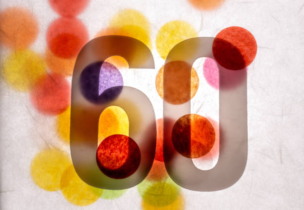 istock 60 number sixty, graphic black digit and creative typography with many colourful wheels, happy birthday 1141205179